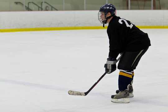 Hockey player patrolling the blue line