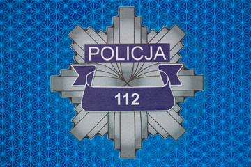 Reflective sticker on the Polish police car © Mariusz Niedzwiedzki