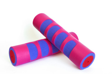 Two pink dumbbell on the white background