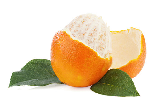 Peeled orange fruit with green leaves isolated on white backgrou