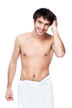 happy young man with the towel around his waist