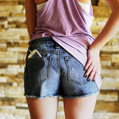 A part of a back and ass in shorts