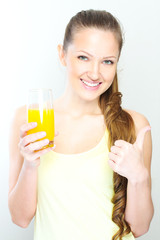 Beautiful happy smiling female with yellow orange juice.
