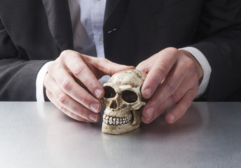 concept of doctor at work on human skull