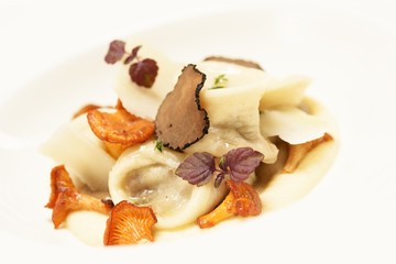 Dumpling with mushrooms and slice of meat