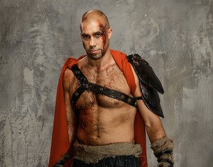 Wounded gladiator in red coat