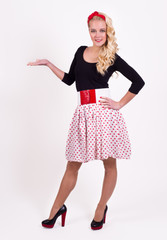 Isolated retro girl in polka-dotted skirt