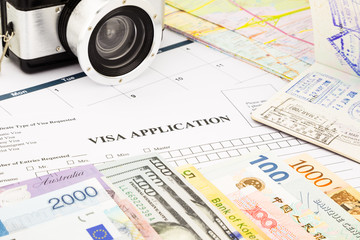 visa application form, passport, world currency and banknotes