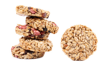 Stack of round candied seeds and nuts.