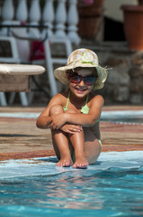Happy Little Girl in Swimming Pool
