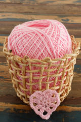 Crochet valentine heart on wooden table