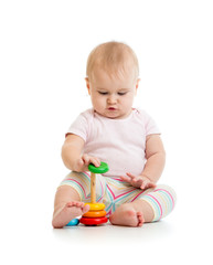 adorable baby playing with color toy