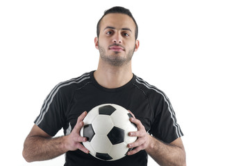 Football player holding the ball with his hands
