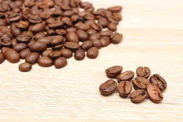 Heap of coffee on wooden background