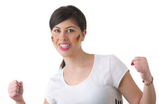 Young woman cheering for Germany with flags painted on her face