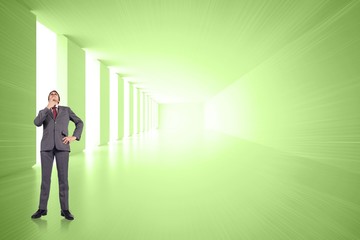 Obraz premium Composite image of thinking businessman touching chin