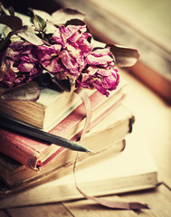 Vintage background with Roses on old books