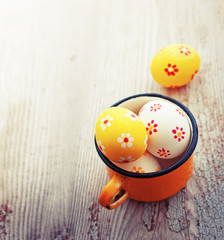 Colorful Easter eggs on wooden background