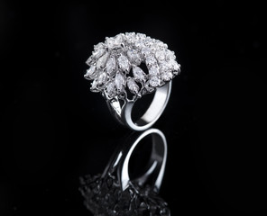 Diamond ring shot on a black reflective background © Ramzi