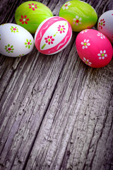 Colorful Easter eggs on wooden background