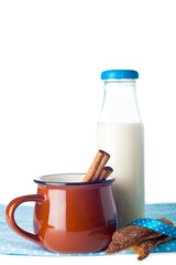 Brown mug, milk, cinnamon and cookies