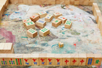 playing in mahjong board game by wooden tiles