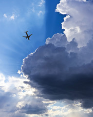 An Airliner, Blue Sky, Clouds and Sunbeams