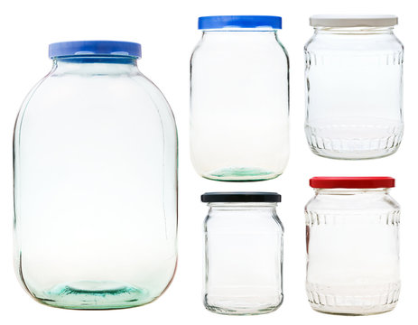 set of closed glass jars isolated on white