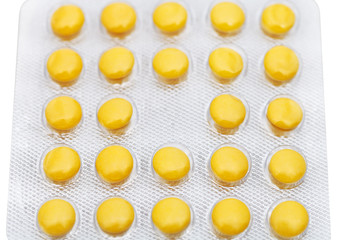 yellow tablets in blister pack isolated