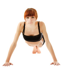 A young woman doing exercises isolated on white background.