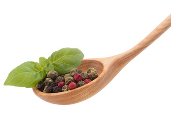 Pepper seasoning  mix in wooden spoon isolated on white backgrou