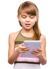 Young girl is using tablet