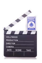 clapper board and pack of cards