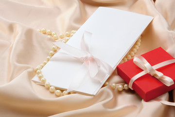 gift on red silk satin background.