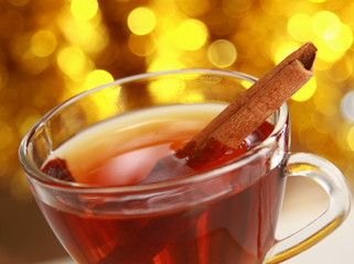 Hot christmas drink with cinnamon sticks