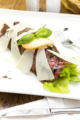 carpaccio at a restaurant on a white background