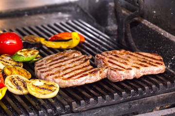 cooking a steak on the grill
