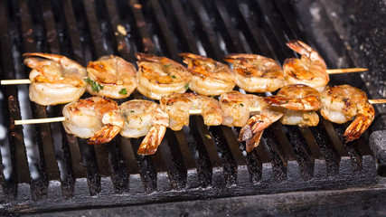 cooking shrimp on the grill in the restaurant