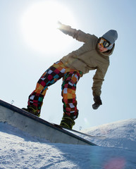 Snowboarder standing on board.