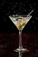 splashing martini olives