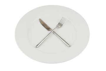 Plate with knife and fork on white
