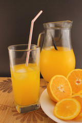 Glass and jug of orange soda