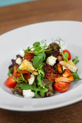 Image of tasty salad in dish in restaurant