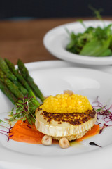 Image of tasty italian food with asparagus served in restaurant
