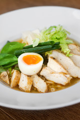 Image of tasty soup with chicken and egg in dish