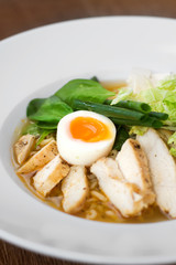 Image of tasty soup with chicken and egg in dish
