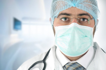 male surgeon gazing and looking at camera at hospital