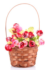 Fototapeta na wymiar Bouquet of beautiful artificial flowers in wicker basket,