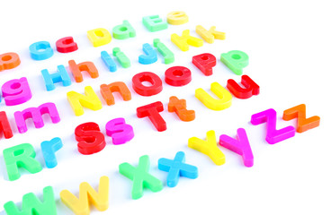 Fototapeta premium Colorful magnetic letters isolated on white