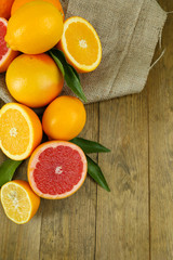 Lots ripe citrus on wooden background